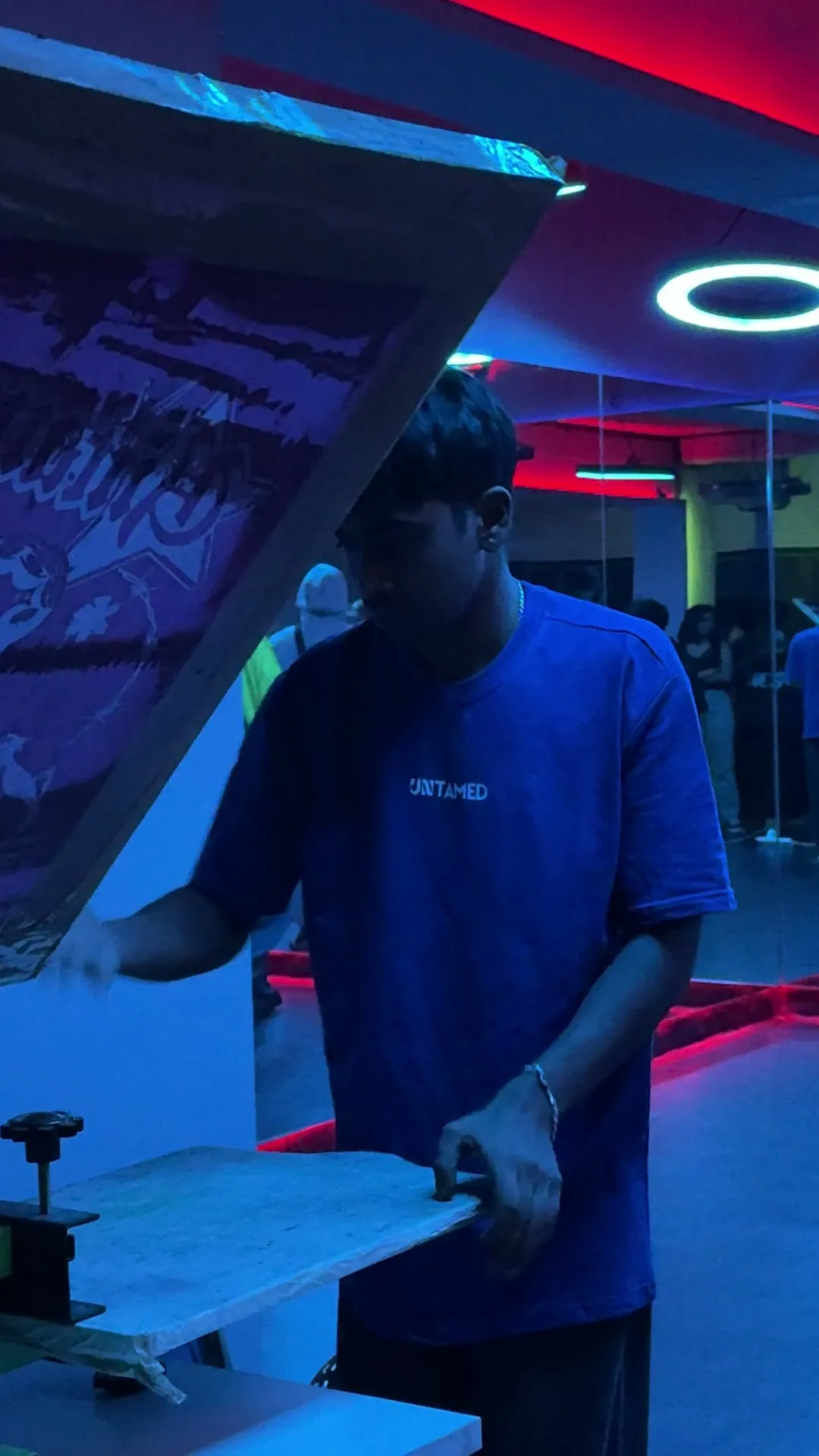 Untamed screen-printing tees live on the floor